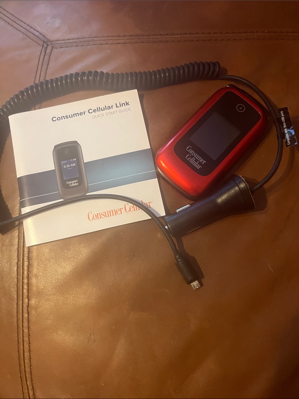 Consumer Cellular Red Flip Phone with  car Charger.